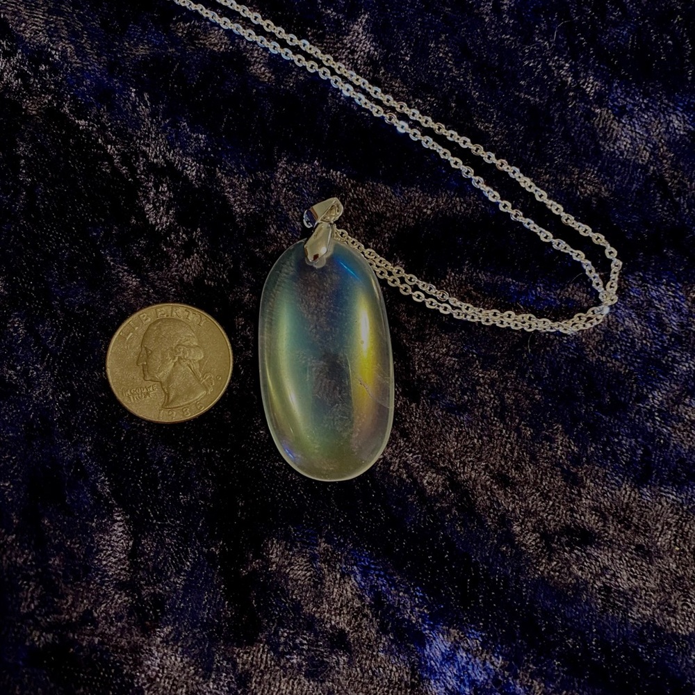 Beautiful angel aura pendant on sparkling chain.